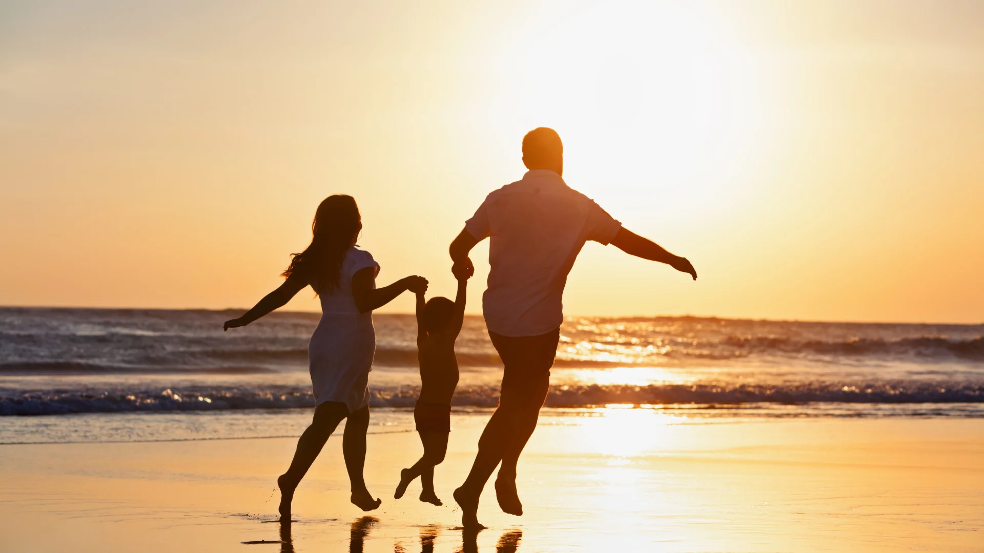 Family strolling on a Caribbean beach